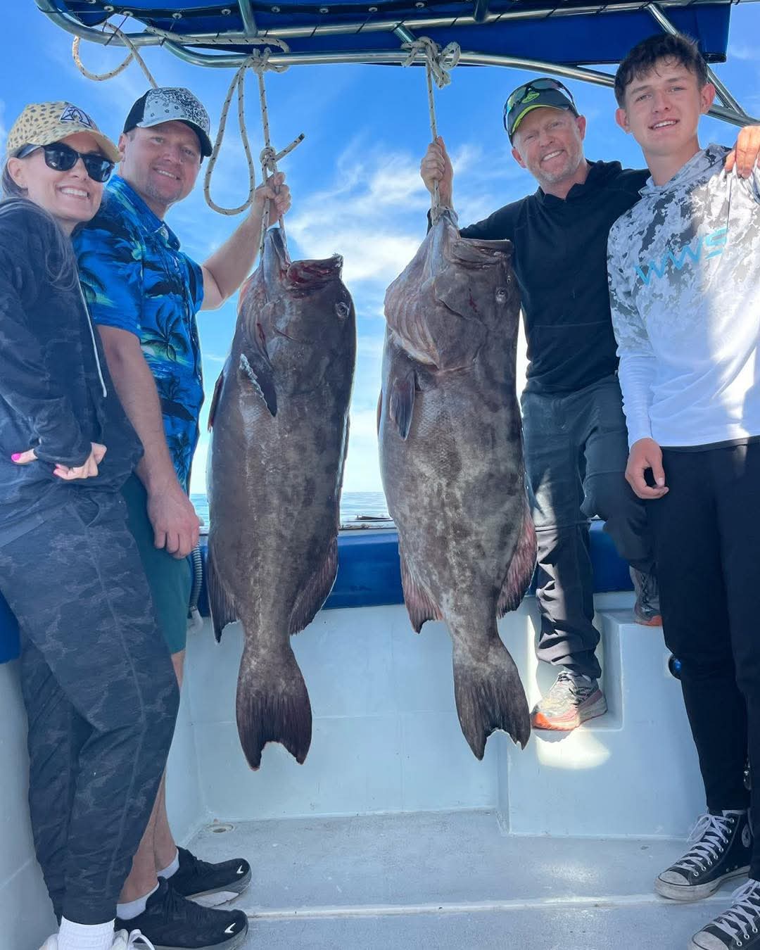 Fishing group with two trophy grouper caught near Rocky Point